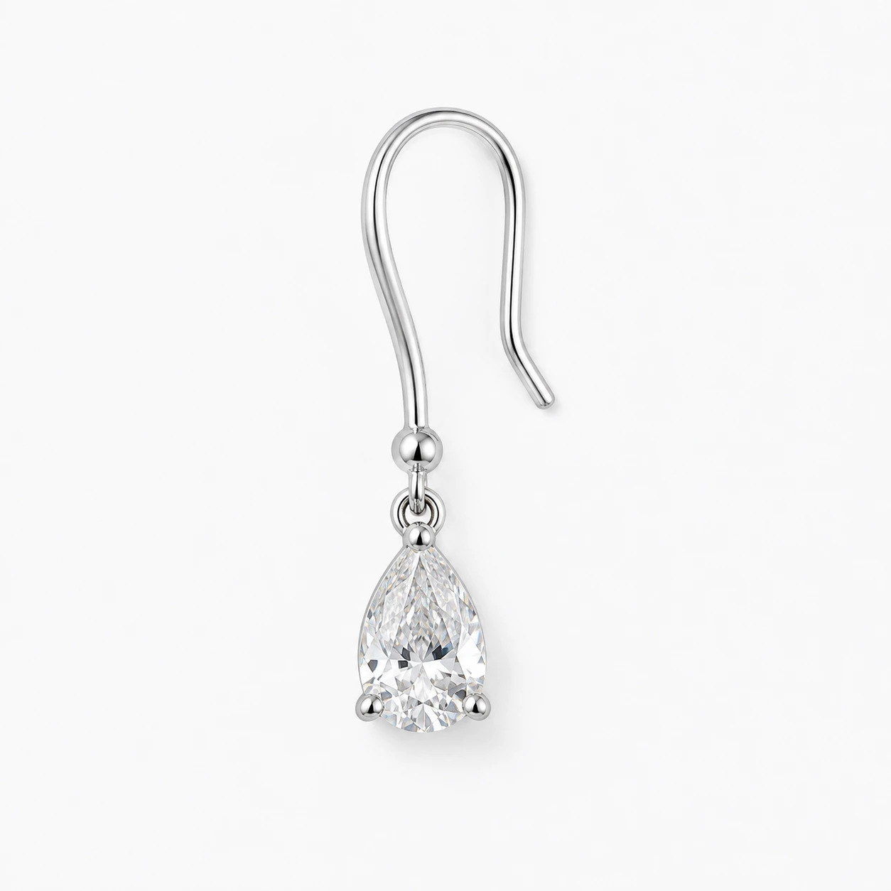 One drop earring angled toward the camera, showing its fish-hook wire, jump ring and pear-cut stone.